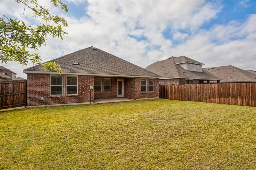 9813 Daisy Mae Aubrey, TX 76227 - Photo 26 of 28 a front view of a house with yard and tree