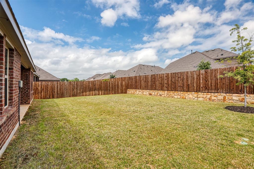9813 Daisy Mae Aubrey, TX 76227 - Photo 27 of 28 a swimming pool with wooden fence