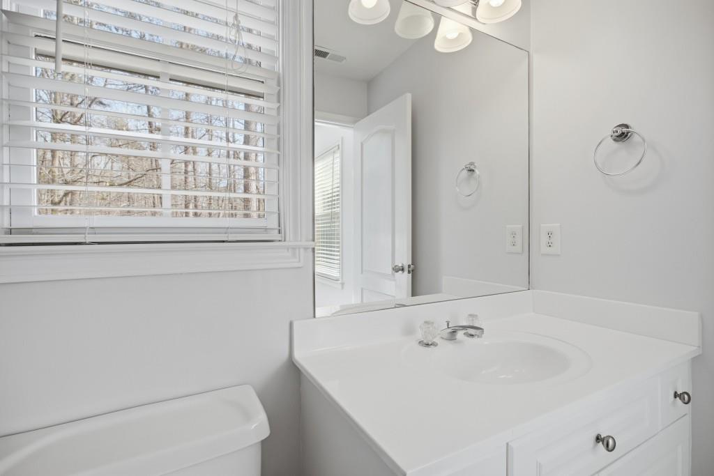 1287 Harris Commons Place Roswell, GA 30076 - Photo 16 of 25 a bathroom with a sink and a bathtub