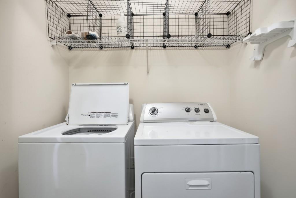 1287 Harris Commons Place Roswell, GA 30076 - Photo 18 of 25 a utility room with dryer and washer