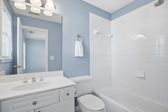 a front view of a house with parking space