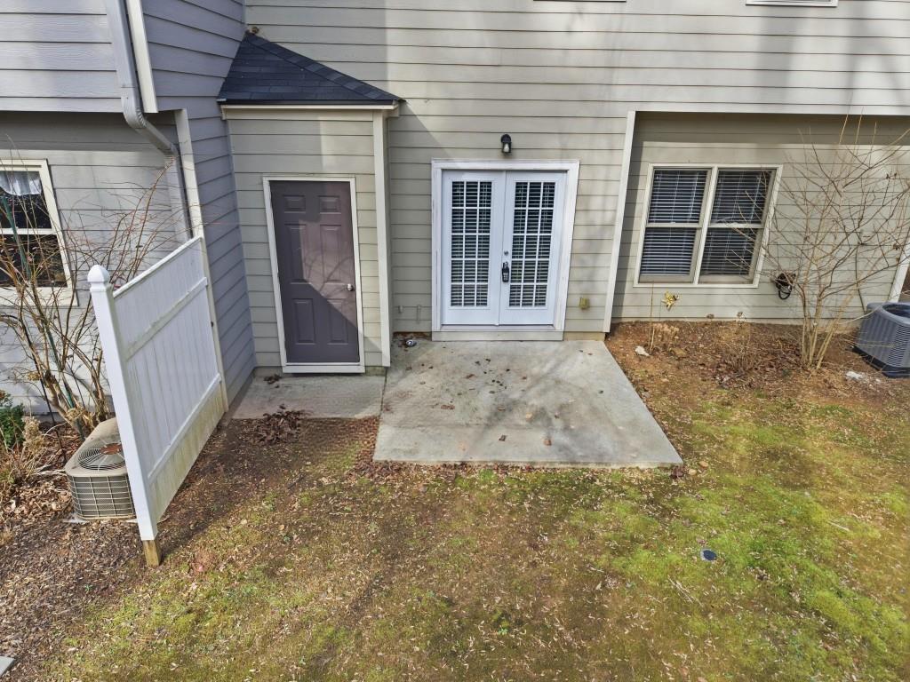 1287 Harris Commons Place Roswell, GA 30076 - Photo 21 of 25 front view of a house with a yard