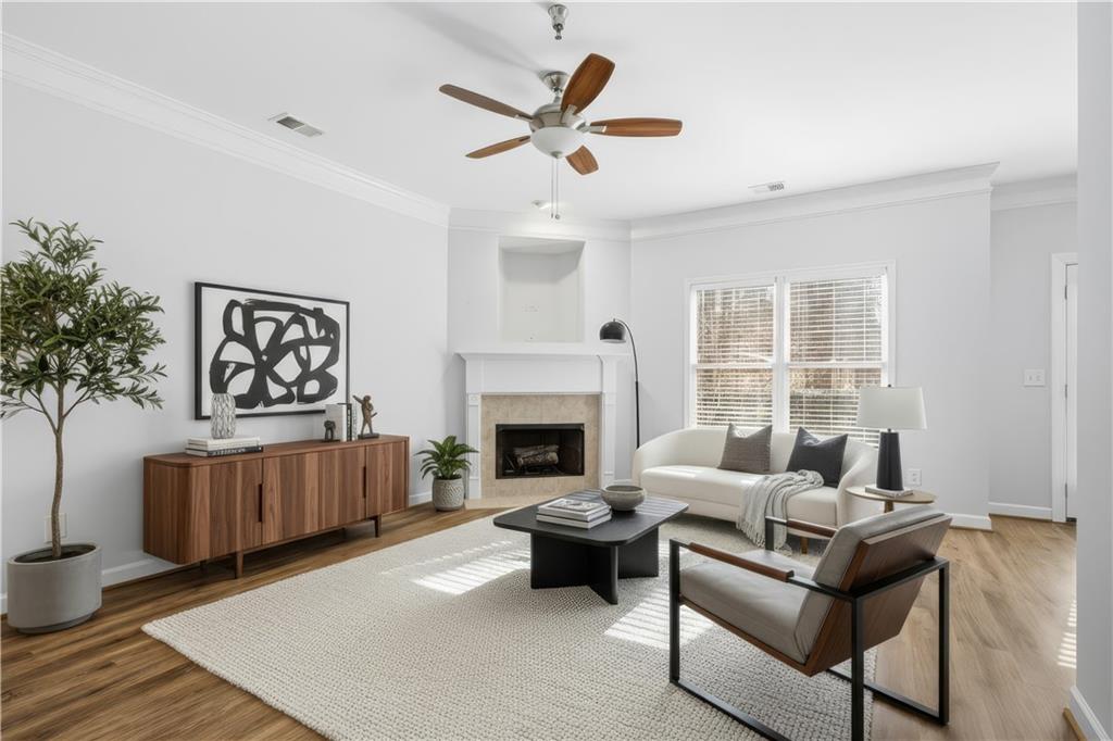 1287 Harris Commons Place Roswell, GA 30076 - Photo 3 of 25 a living room with furniture and a fireplace