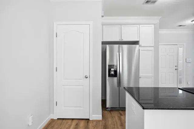 a white toilet sitting next to a bathroom sink