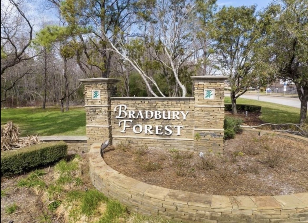 3023 Native Spg Drive Spring, TX 77373 - Photo 4 of 6 a view of a street sign under large trees