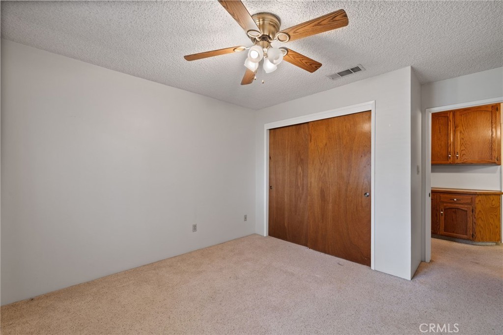 2065 Jenkins Road Bakersfield, CA 93314 - Photo 31 of 59 a view of empty room with window and ceiling fan