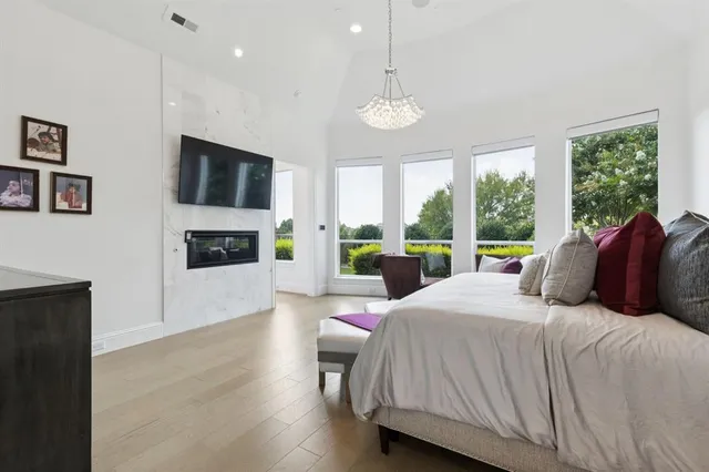 a bedroom with a large bed and a large window