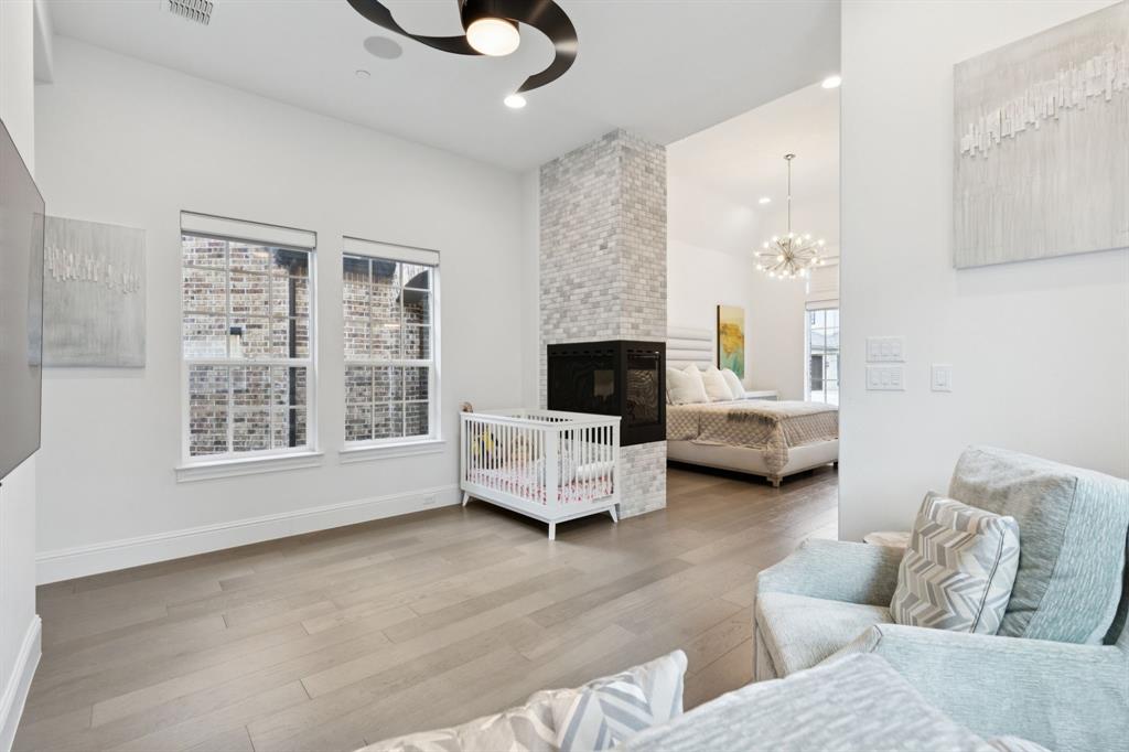 818 Brett Drive Allen, TX 75013 - Photo 12 of 28 a living room with furniture or couch and a flat screen tv