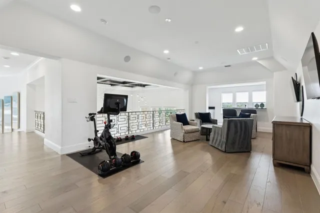a living room with furniture flat screen tv and a fireplace