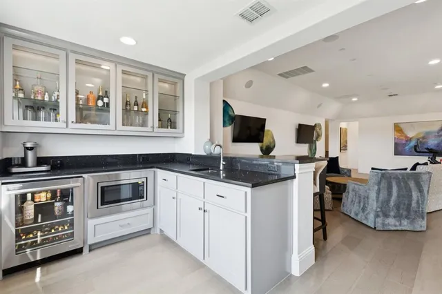a kitchen with stainless steel appliances granite countertop a stove and a sink