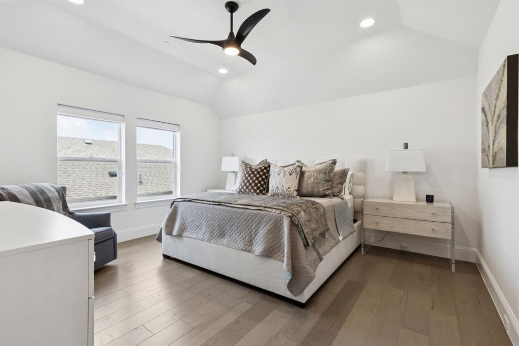 818 Brett Drive Allen, TX 75013 - Photo 21 of 28 a spacious bedroom with a bed and a window