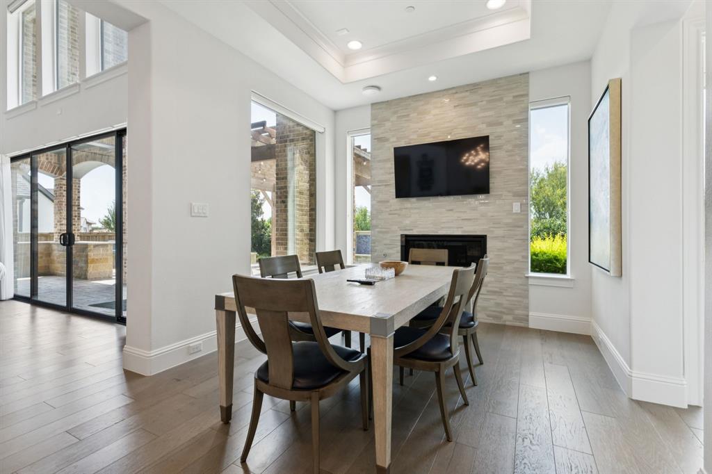 818 Brett Drive Allen, TX 75013 - Photo 8 of 28 a dining room with furniture and wooden floor