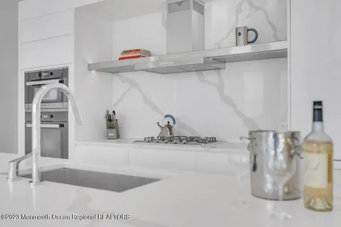 a bathroom with a shower and a sink