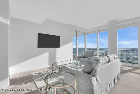 a bed room with a bed and a view of balcony
