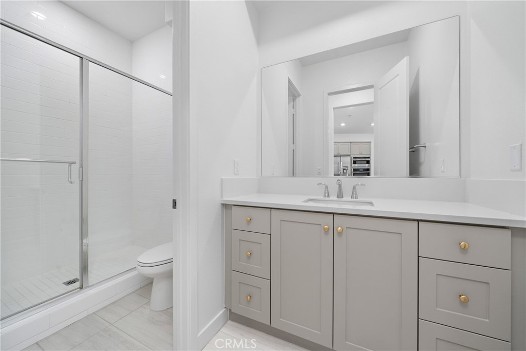 185 Sash Irvine, CA 92618 - Photo 13 of 29 a bathroom with a double vanity sink toilet and shower