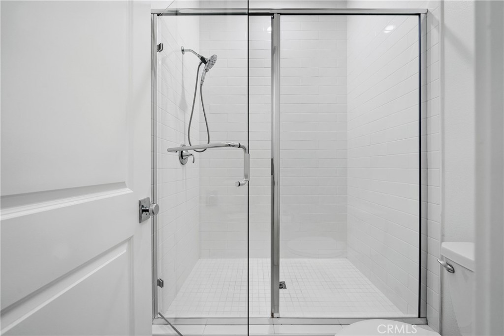 185 Sash Irvine, CA 92618 - Photo 14 of 29 a bathroom with a glass shower door