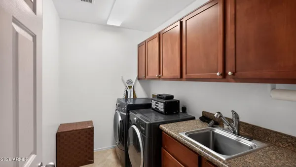 a kitchen with a sink a stove and a microwave oven