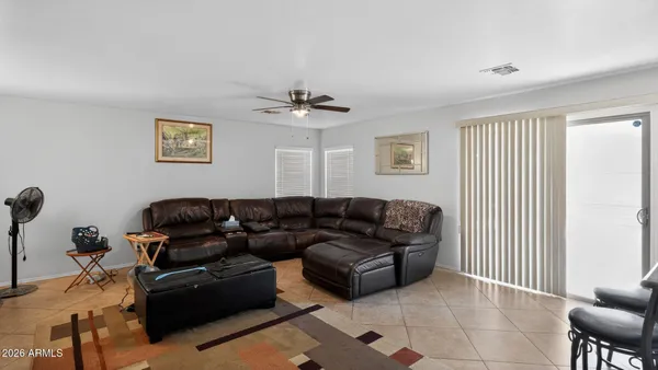a living room with furniture and a window