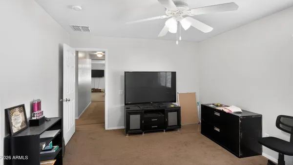 a room with furniture and a flat screen tv