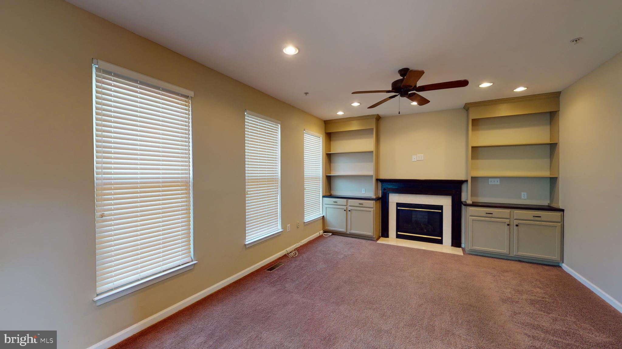 1502 Shellford Lane Accokeek, MD 20607 - Photo 15 of 39 The sunny family room with built-in shelves.