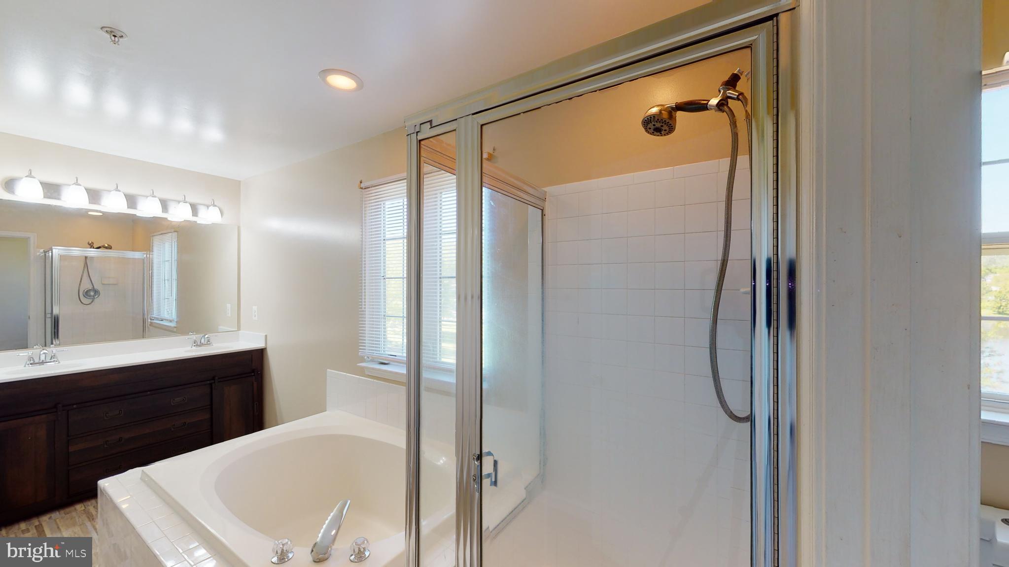 1502 Shellford Lane Accokeek, MD 20607 - Photo 24 of 39 Vanity has unique, sliding doors. Lovely shower!