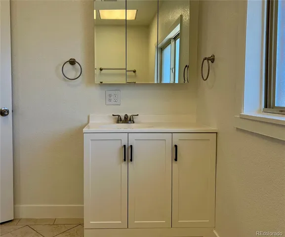 a white toilet sitting next to a bath tub