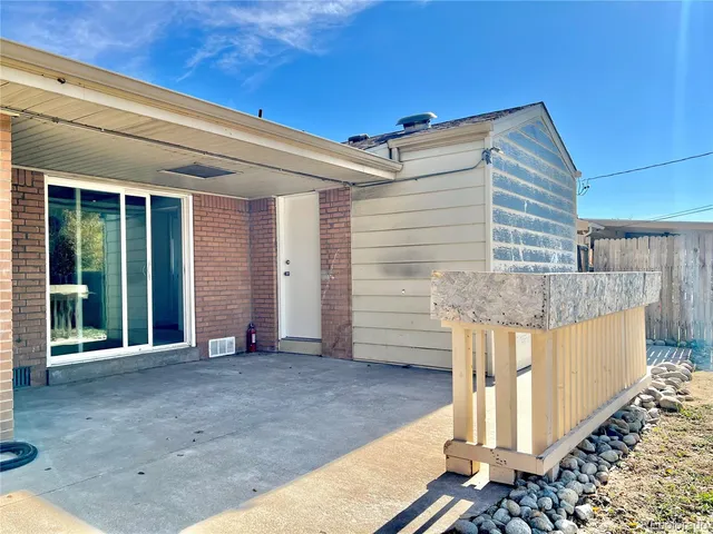 a view of a house with snow on the road