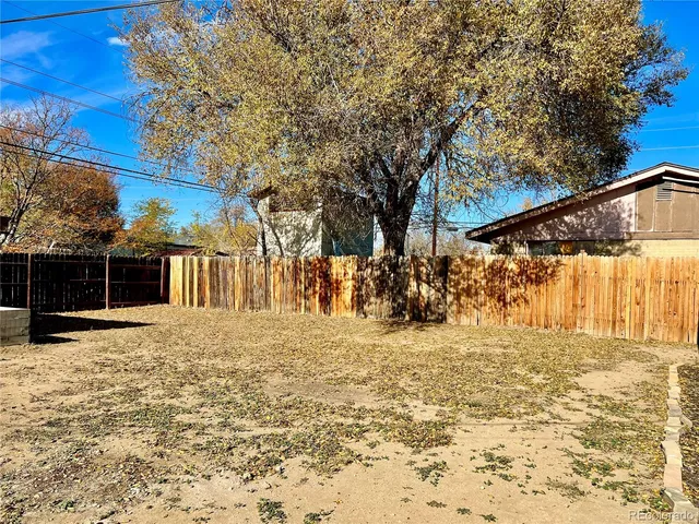 a view of a backyard of the house