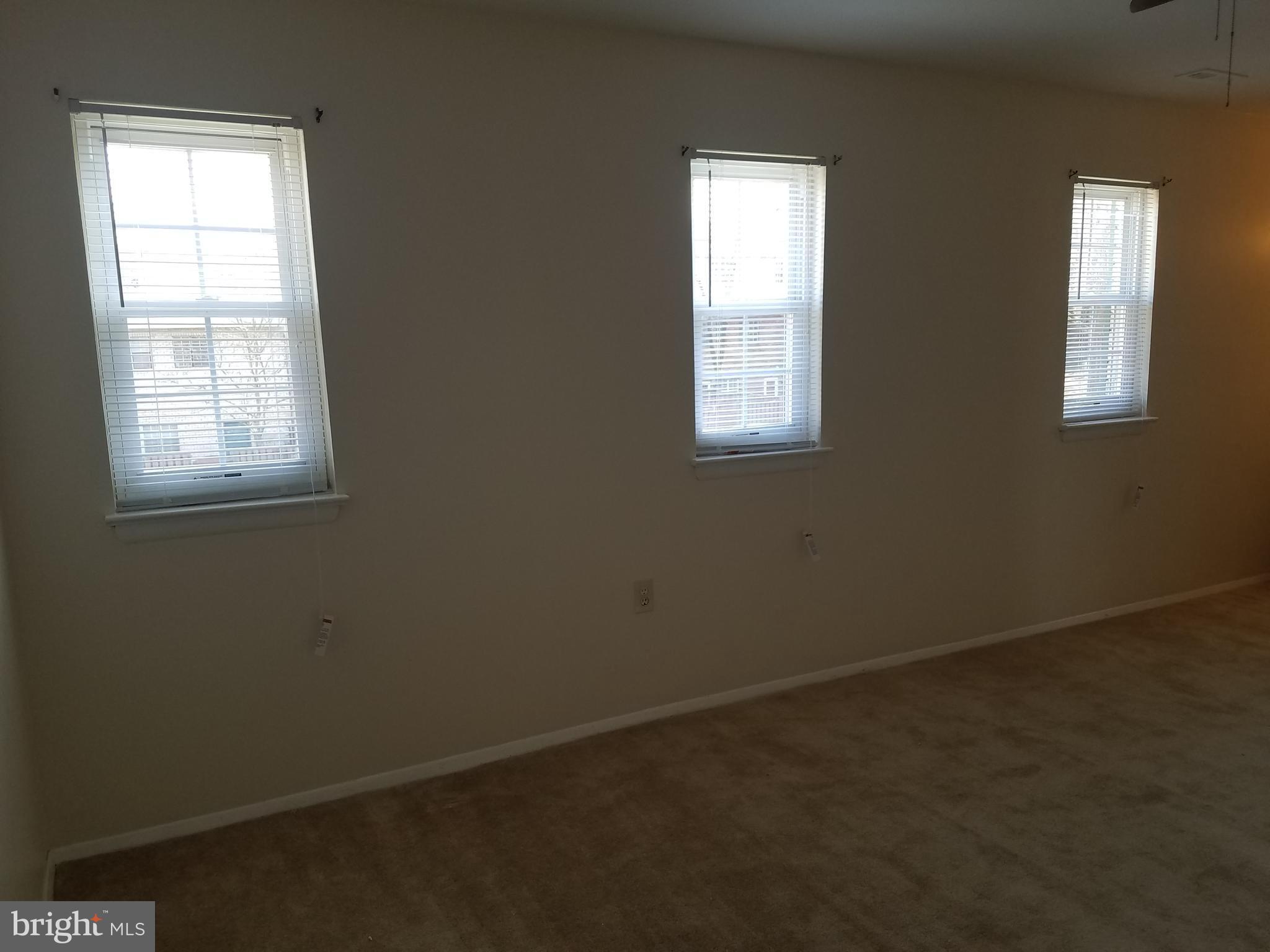 8024 Sandy Spring Road Laurel, MD 20707 - Photo 11 of 21 an empty room with windows