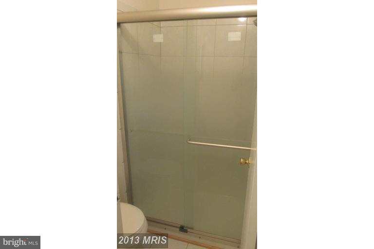 8024 Sandy Spring Road Laurel, MD 20707 - Photo 12 of 21 a bathroom with a shower