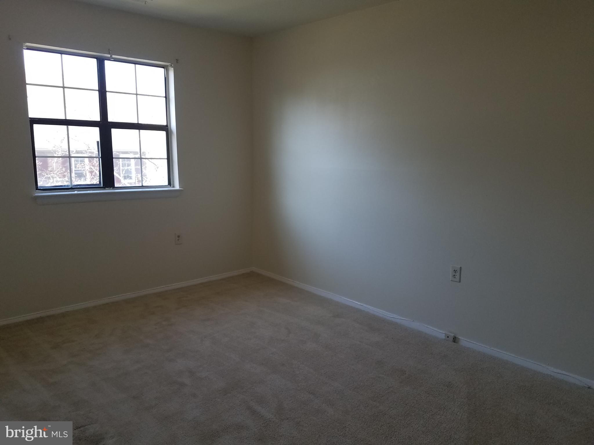 8024 Sandy Spring Road Laurel, MD 20707 - Photo 13 of 21 an empty room with a window