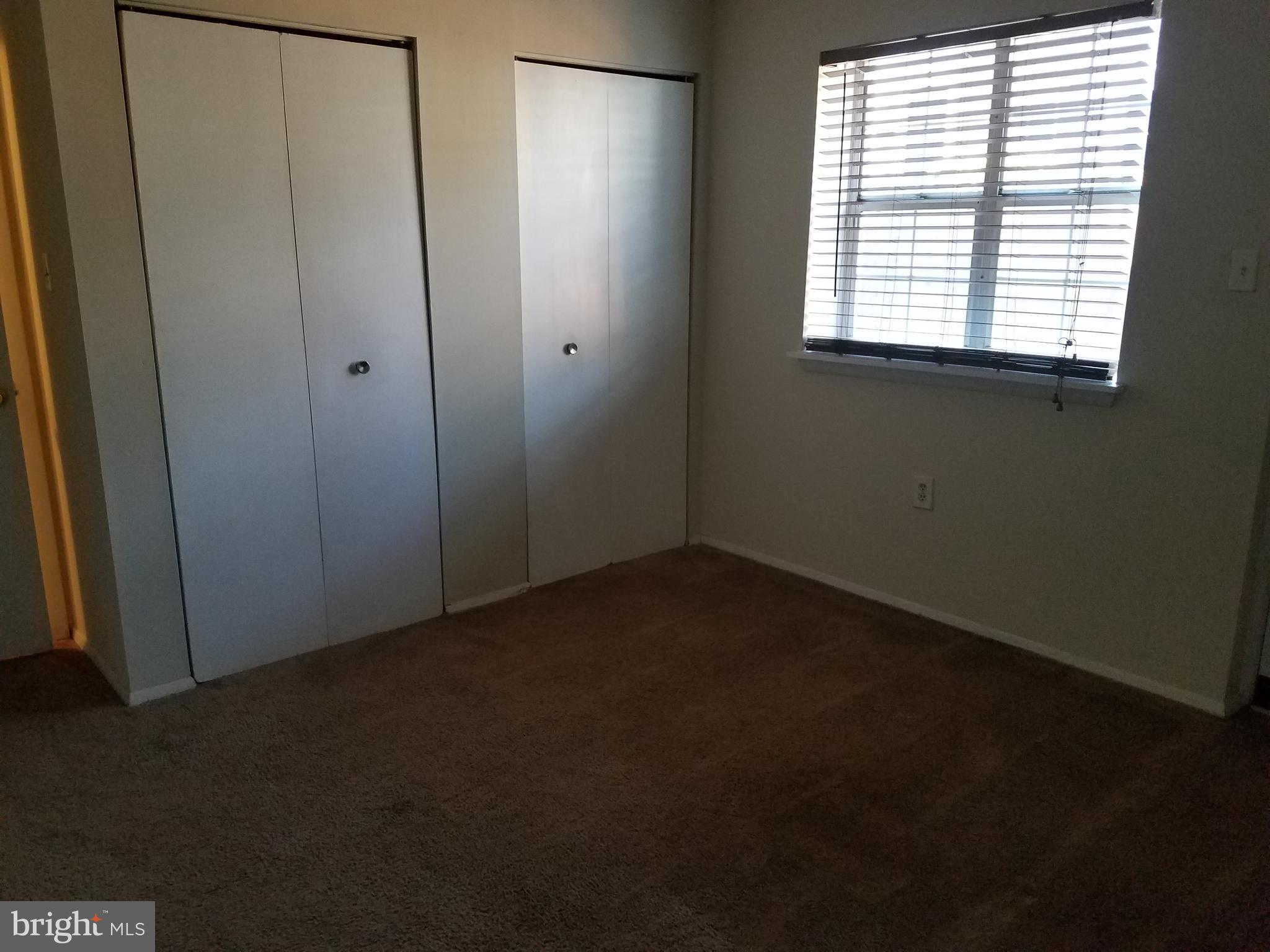 8024 Sandy Spring Road Laurel, MD 20707 - Photo 18 of 21 wooden floor and window in an empty room