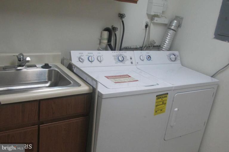 8024 Sandy Spring Road Laurel, MD 20707 - Photo 19 of 21 a utility room with dryer and washer