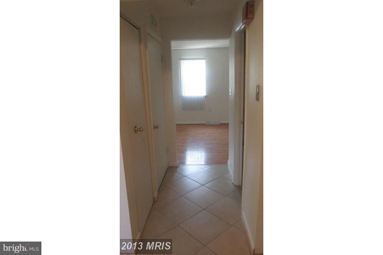 8024 Sandy Spring Road Laurel, MD 20707 - Photo 4 of 21 a view of a hallway with front of a door