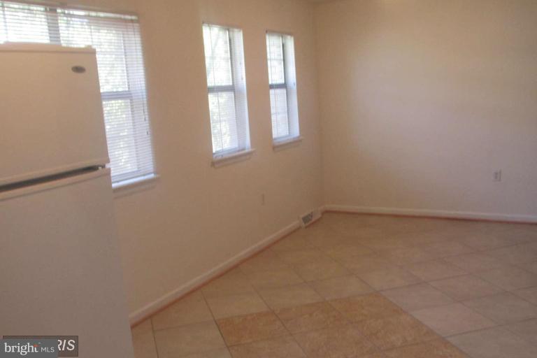 8024 Sandy Spring Road Laurel, MD 20707 - Photo 6 of 21 an empty room with a window
