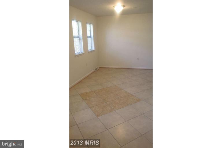 8024 Sandy Spring Road Laurel, MD 20707 - Photo 7 of 21 a view of an empty room