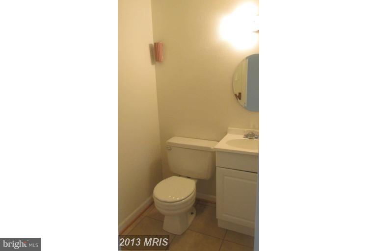8024 Sandy Spring Road Laurel, MD 20707 - Photo 9 of 21 a bathroom with a toilet and a shower