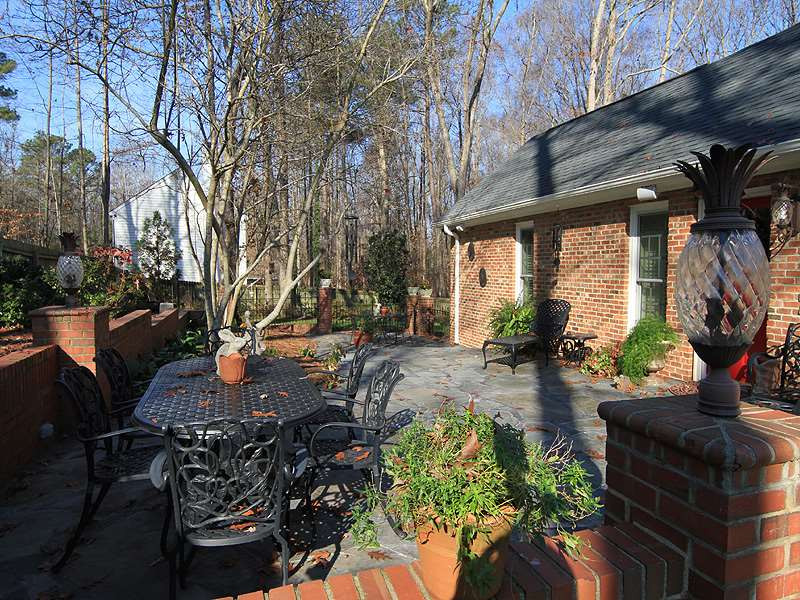 2204 Customs House Court Raleigh, NC 27615 - Photo 24 of 25 Outdoor relaxation and entertaining on this huge, stone patio with speakers for your listening pleasure. Patio