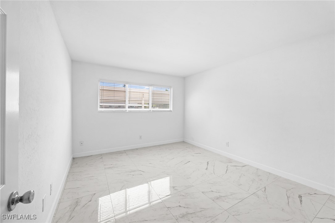 601 Periwinkle Way, Unit D1 Sanibel, FL 33957 - Photo 12 of 25 an empty room with windows
