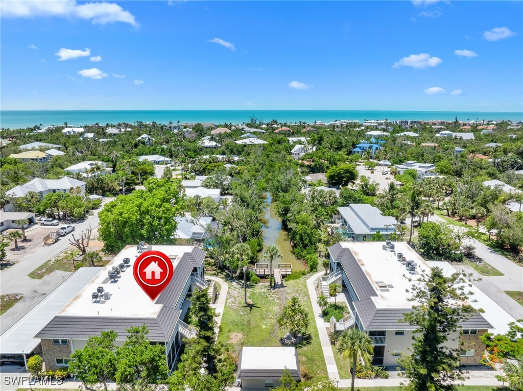 601 Periwinkle Way, Unit D1 Sanibel, FL 33957 - Photo 16 of 25 an aerial view of residential houses with outdoor space and street view