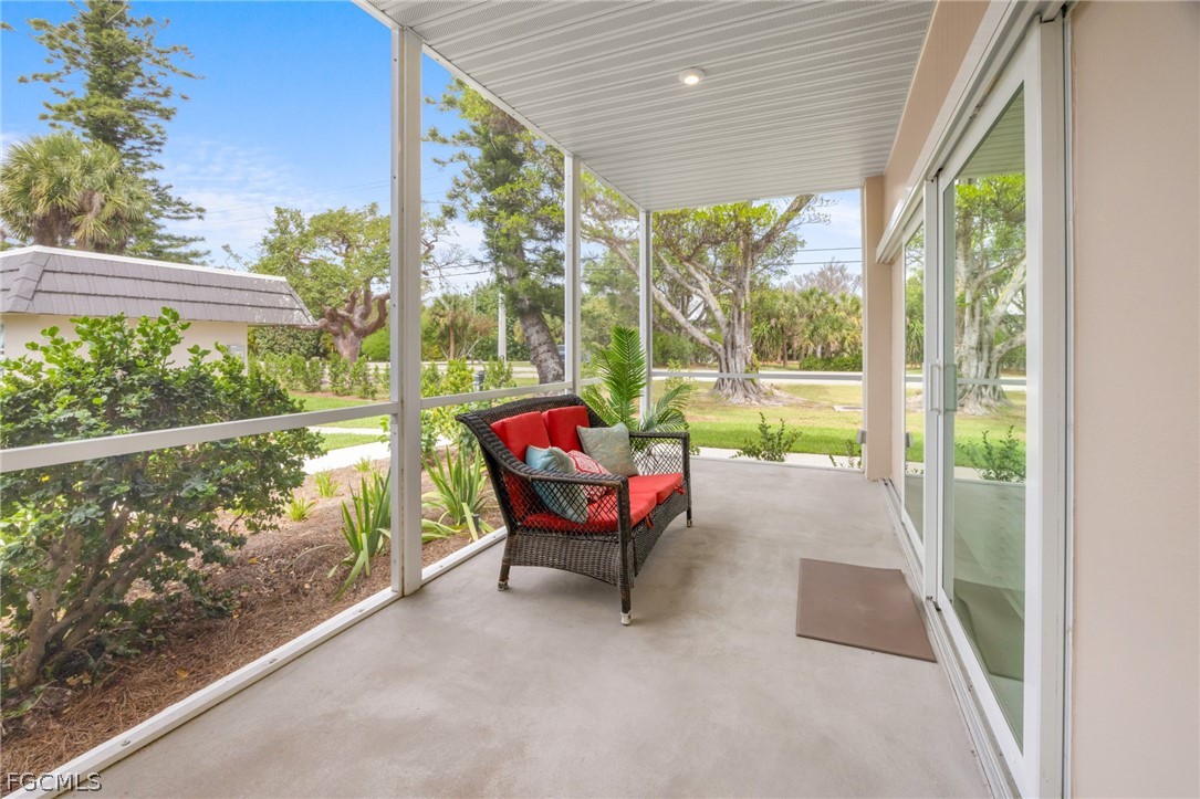 601 Periwinkle Way, Unit D1 Sanibel, FL 33957 - Photo 20 of 25 a balcony with couple of chairs and a couch