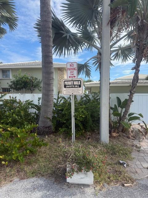 5520 North Ocean Boulevard, Unit 111 Ocean Ridge, FL 33435 - Photo 43 of 63 sign leading to beach path