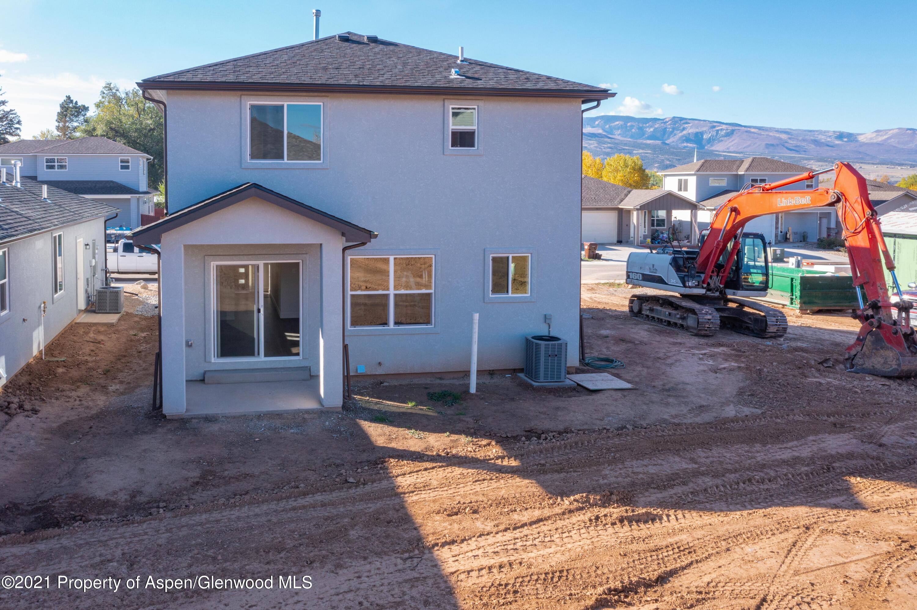 1664 East 17th Circle Rifle, CO 81650 - Photo 2 of 11 a front view of a house with garden