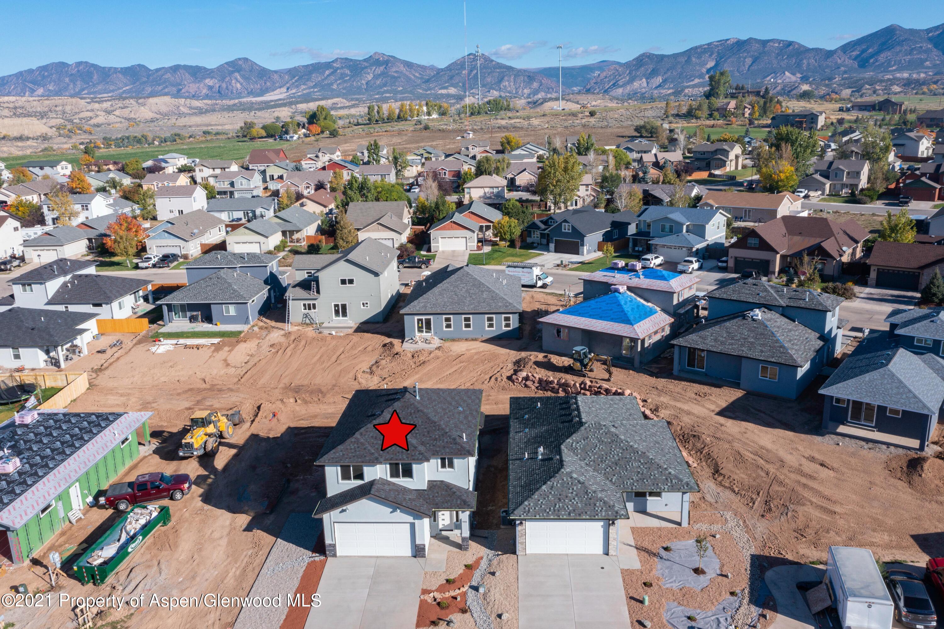1664 East 17th Circle Rifle, CO 81650 - Photo 3 of 11 an aerial view of a city with lots of residential buildings