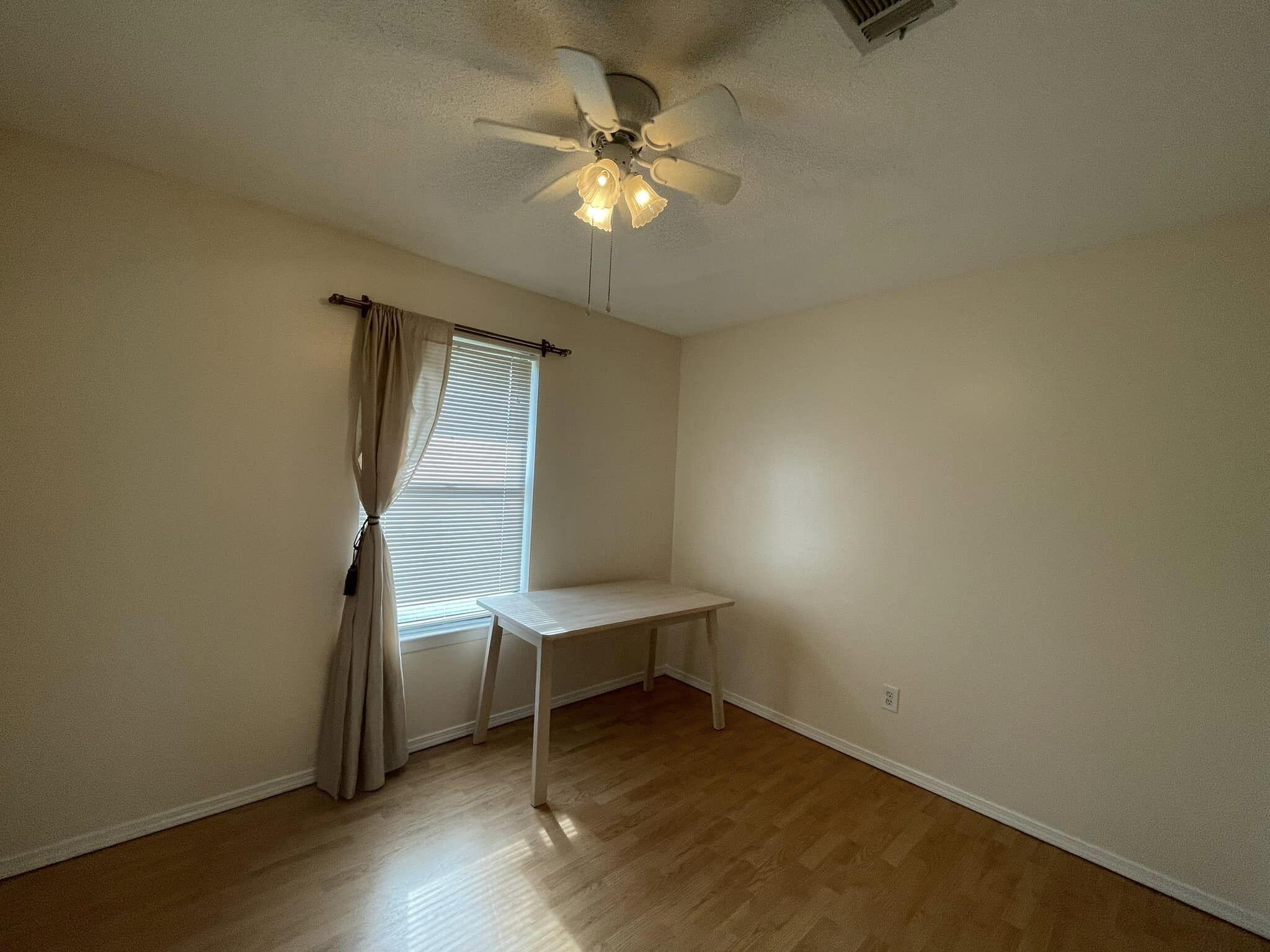 688 Roberts Drive DeFuniak Springs, FL 32433 - Photo 14 of 19 a workspace with wooden floor and a window