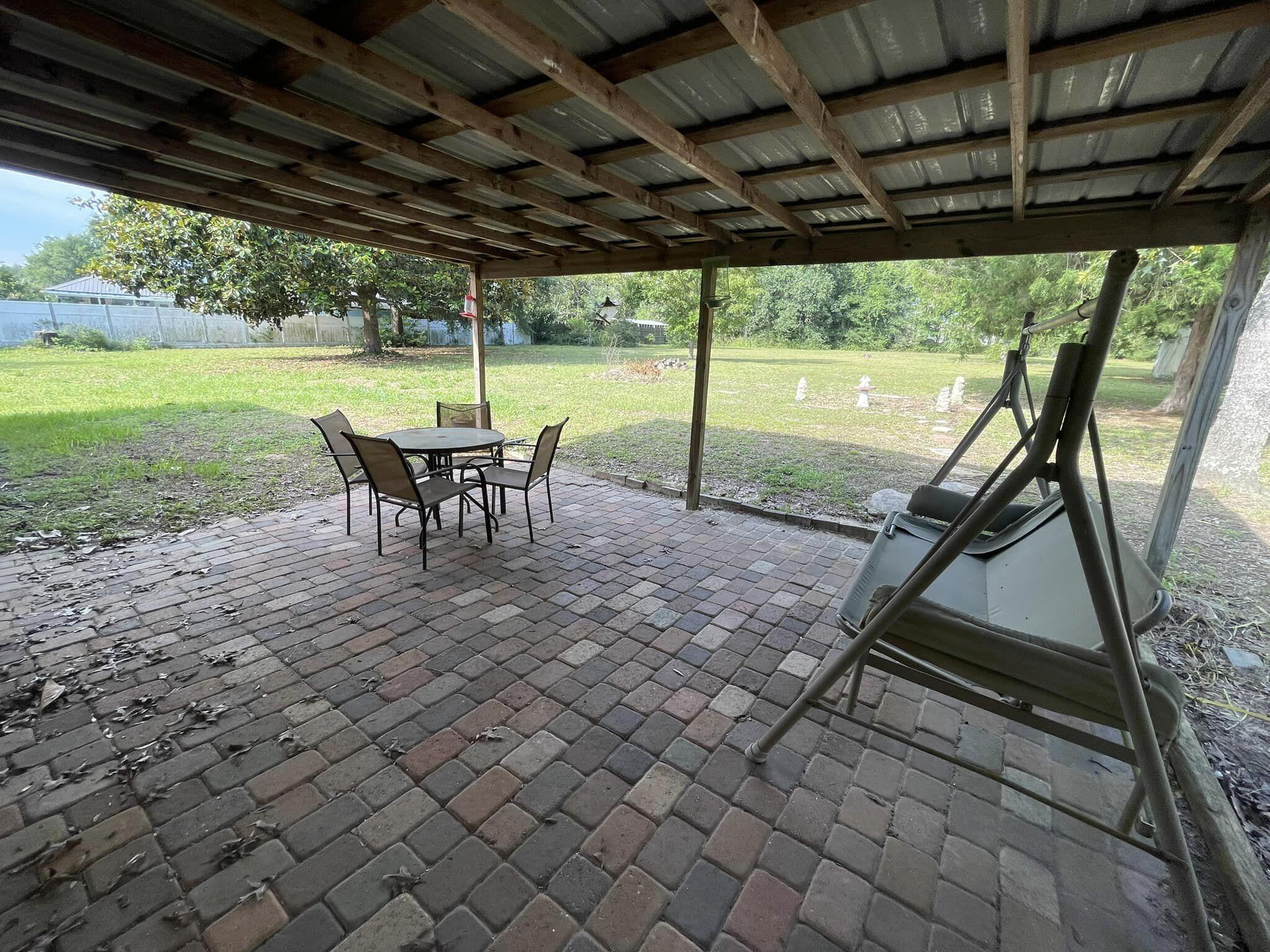 688 Roberts Drive DeFuniak Springs, FL 32433 - Photo 18 of 19 a view of a swimming pool with a backyard