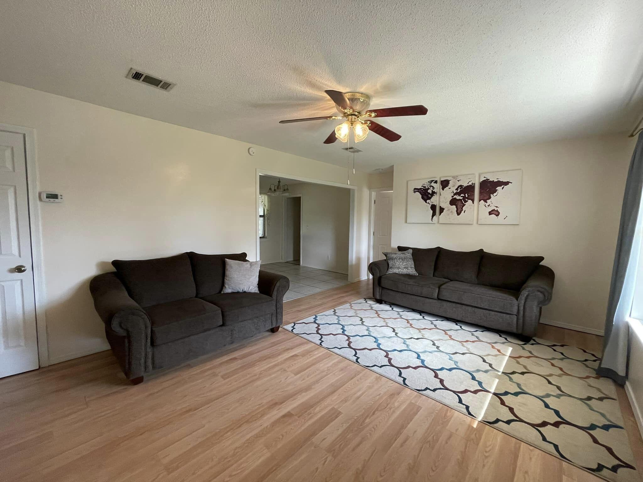 688 Roberts Drive DeFuniak Springs, FL 32433 - Photo 6 of 19 a living room with furniture and a chandelier
