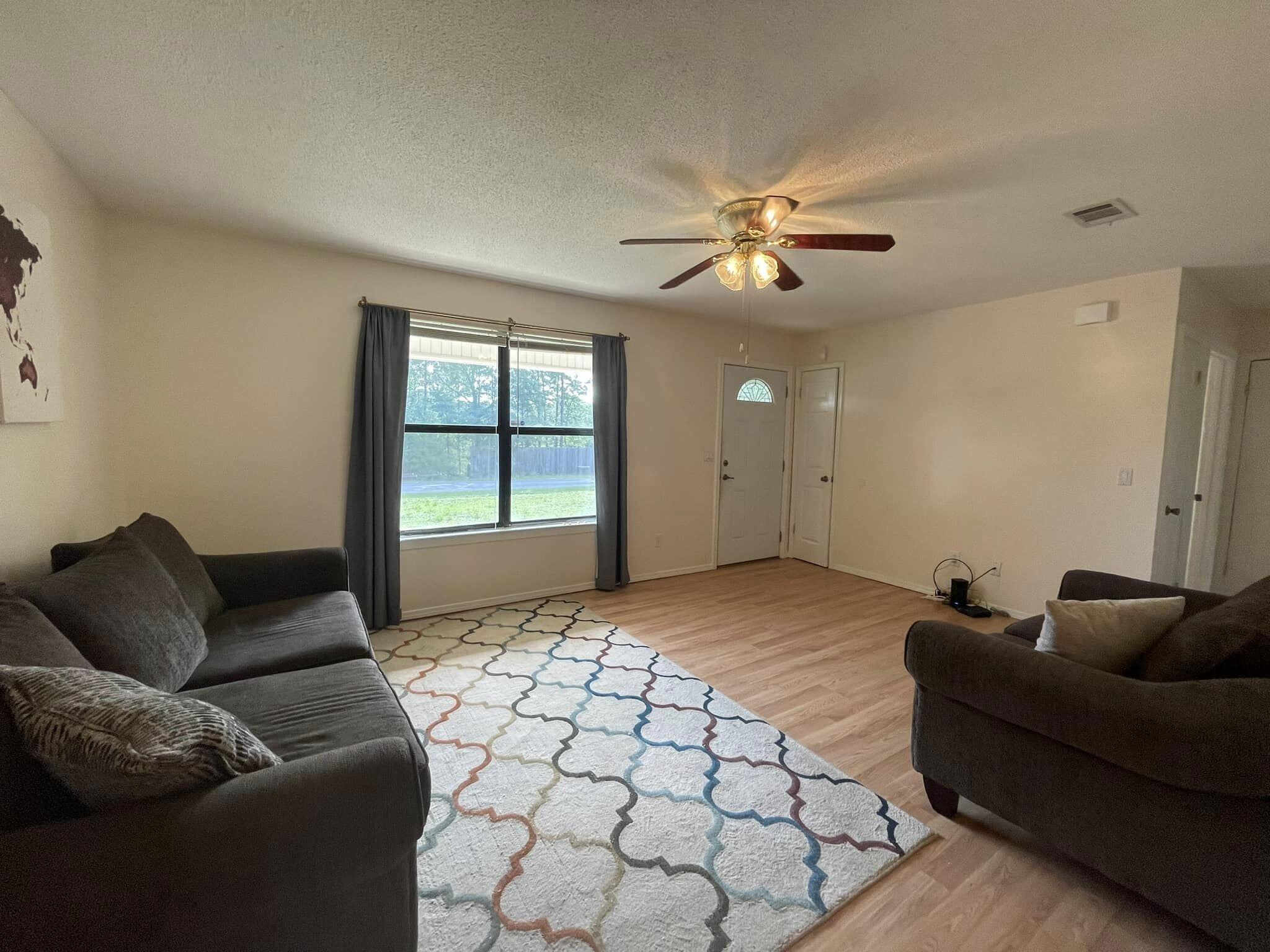 688 Roberts Drive DeFuniak Springs, FL 32433 - Photo 7 of 19 a living room with furniture and a ceiling fan