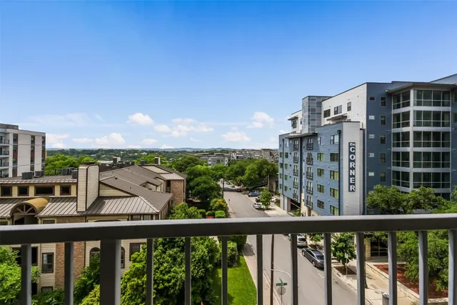 a view of a balcony with city view