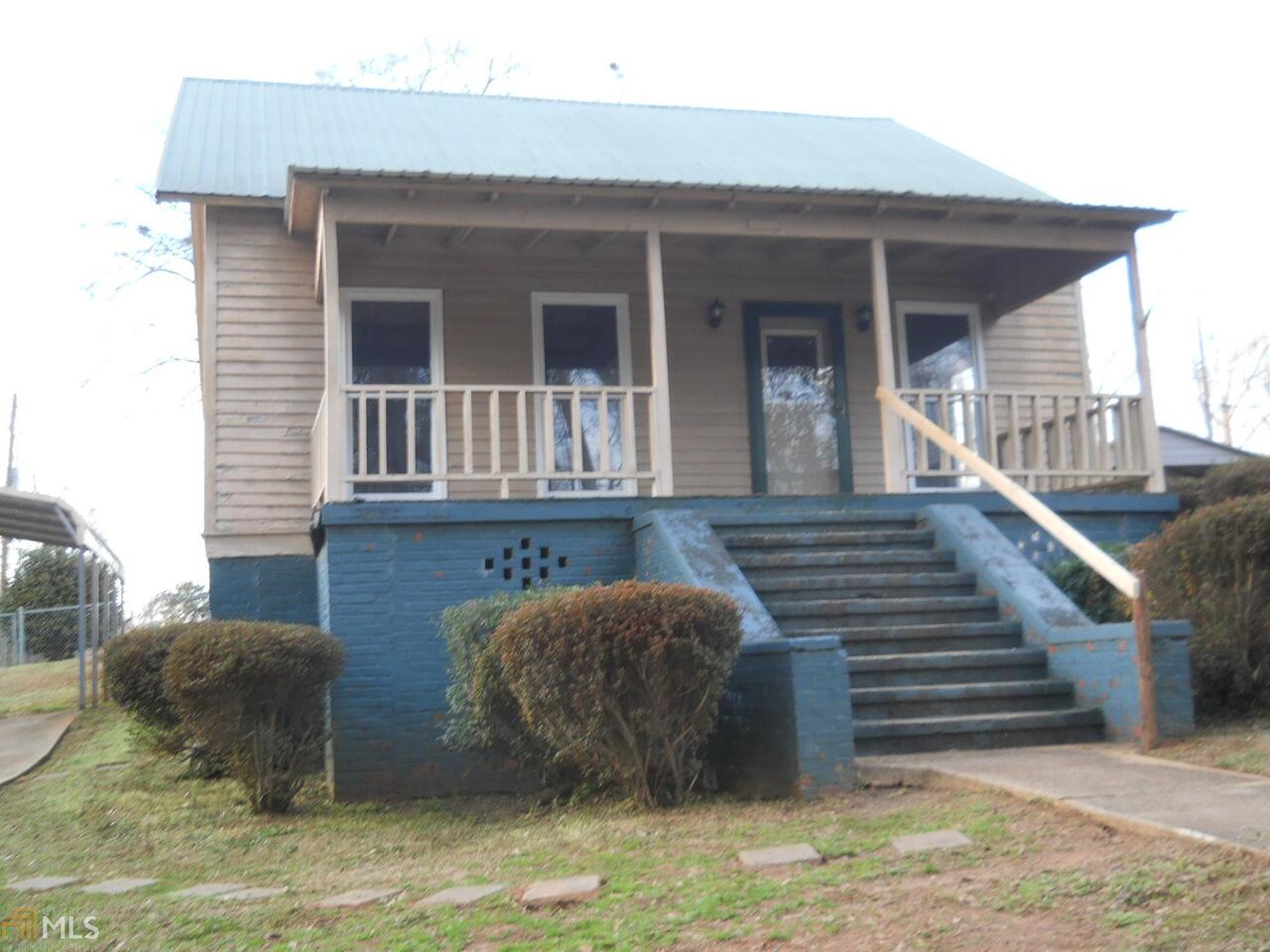 a view of a house with wooden floor and a potted plant